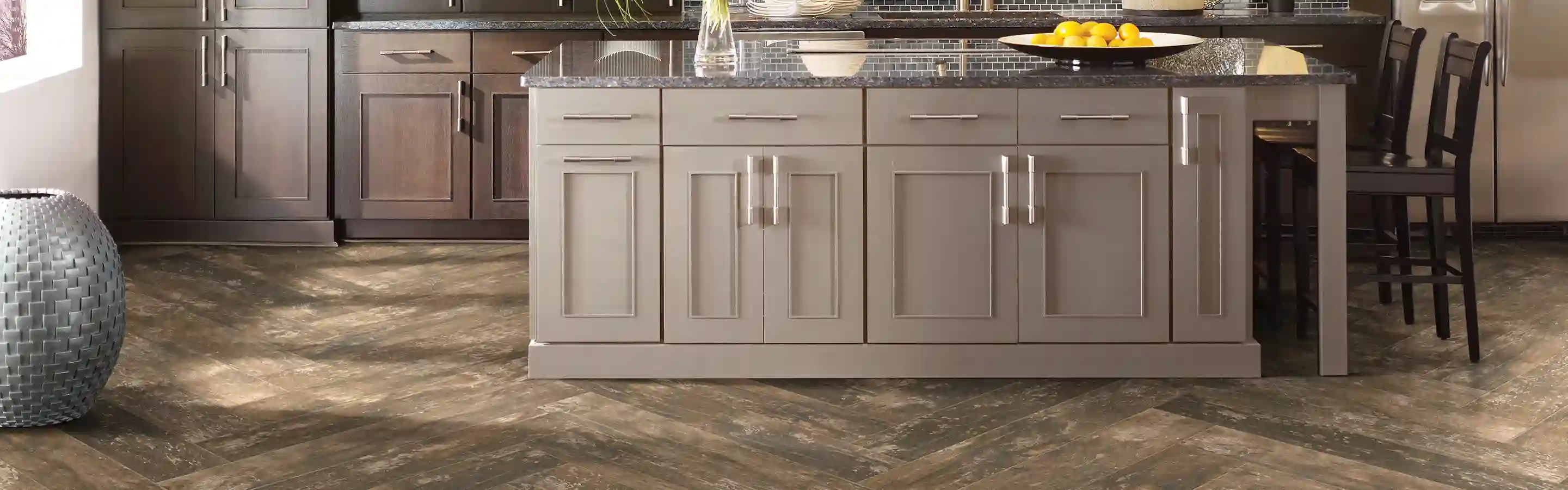 Contemporary kitchen with butcher block island, herringbone tile 